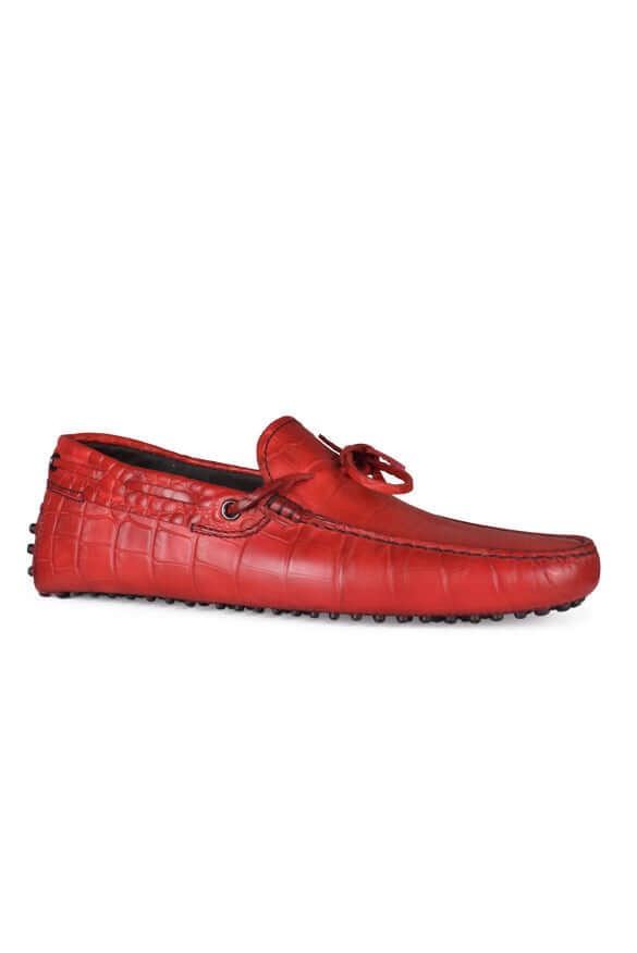 Red leather loafer shoe on a white background