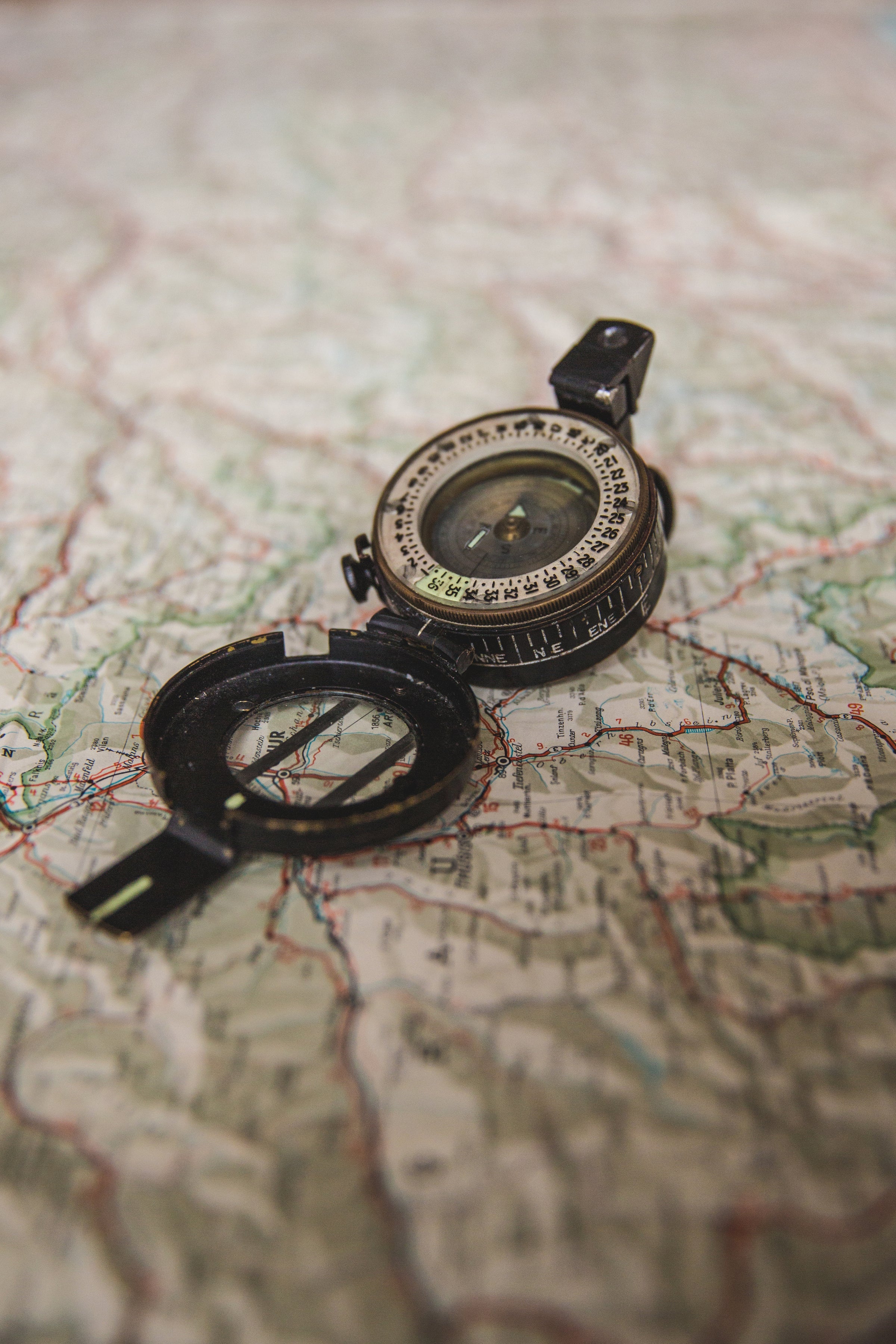 Open Compass sitting on map