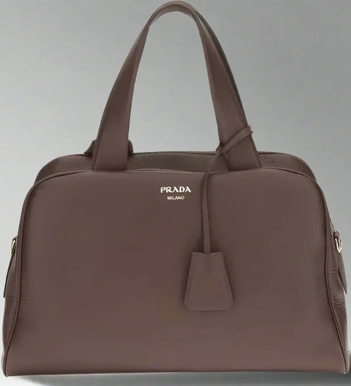 Brown Prada handbag on a white background