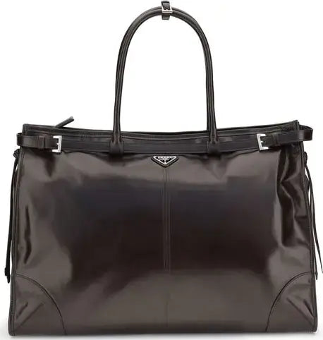 Black handbag with a Prada logo on a white background