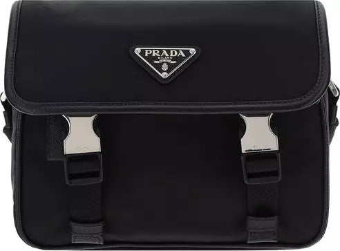 Black Prada bag with silver hardware on a black background
