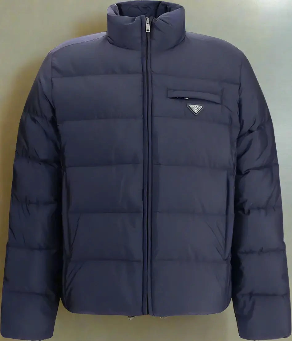 Navy blue puffer jacket with a brand logo on a white background