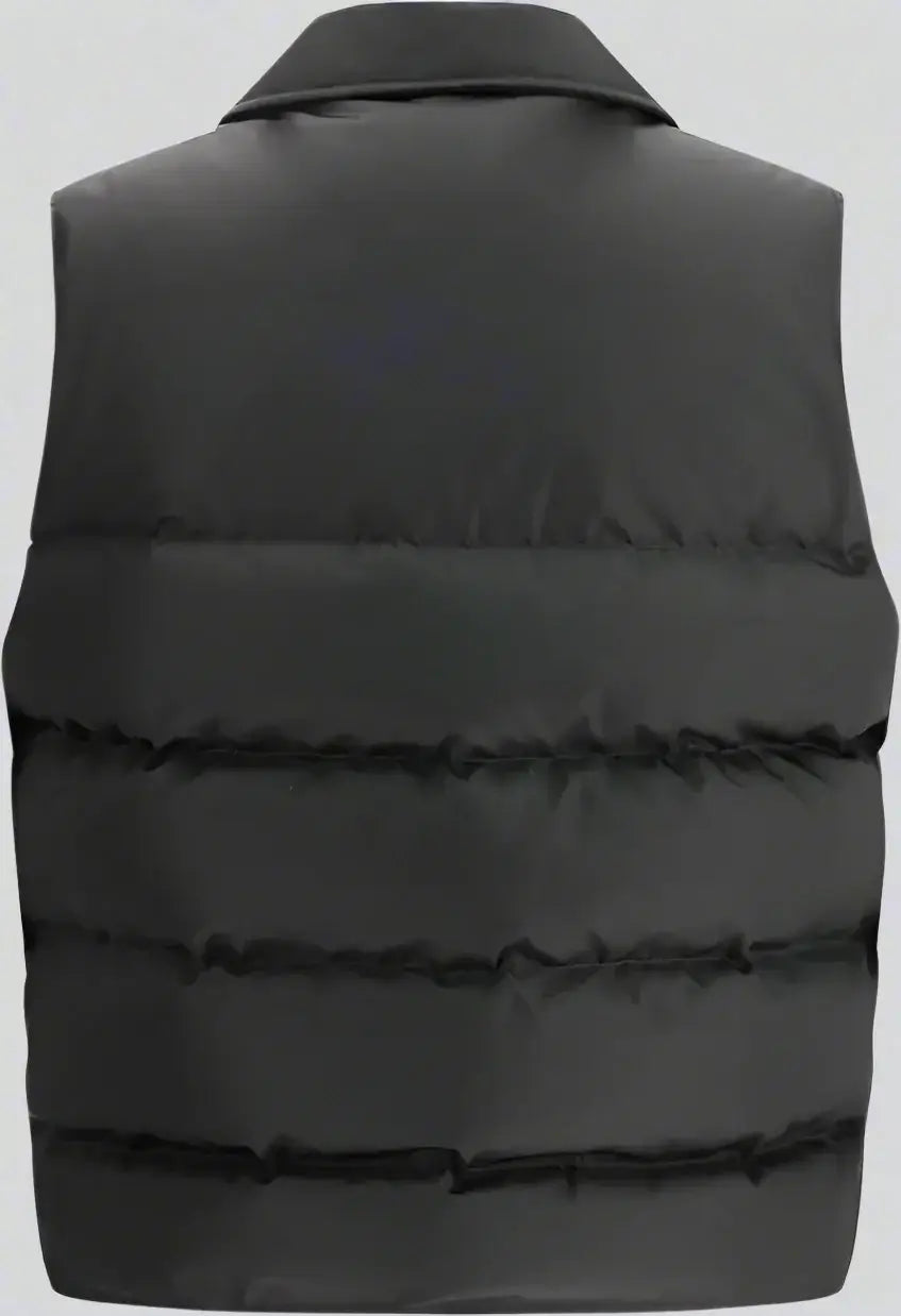 Black puffer vest on a white background
