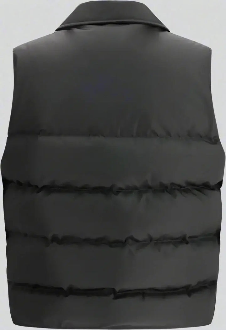 Black puffer vest on a white background