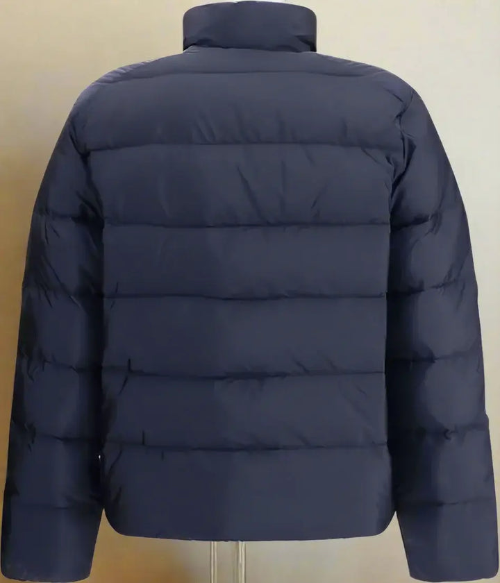 Navy blue puffer jacket on a white background