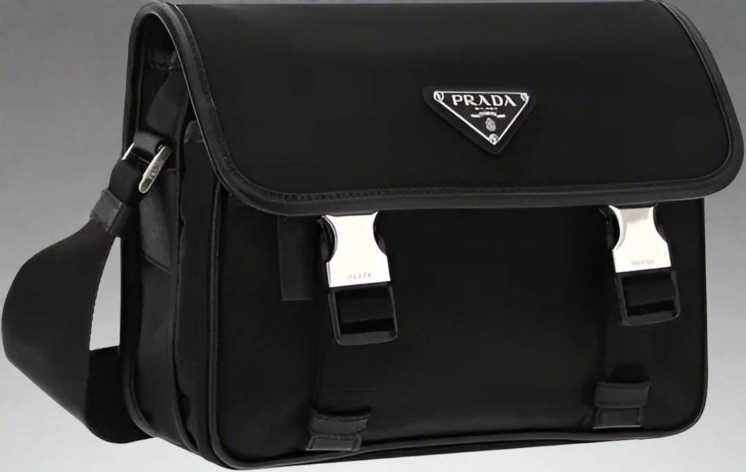 Black Prada bag with a silver logo on a white background