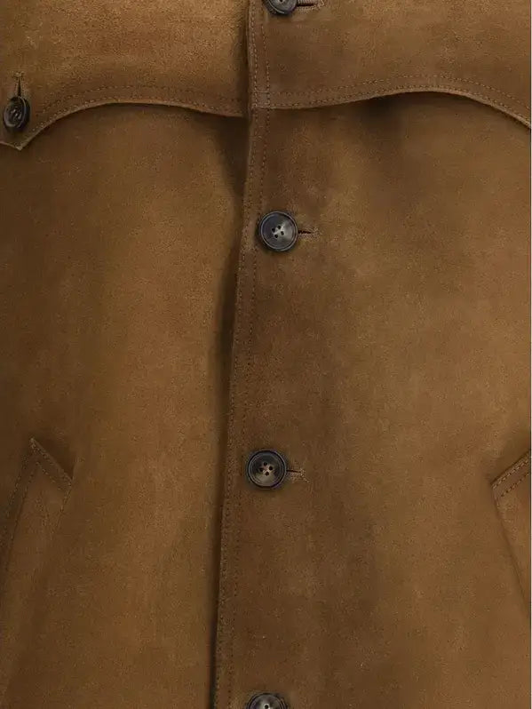 Close-up of a brown suede jacket with buttons