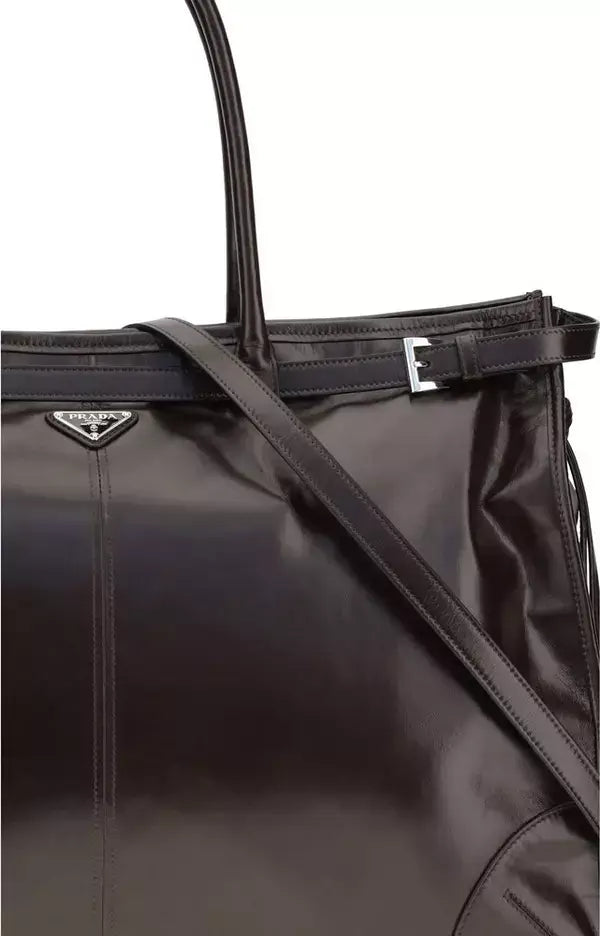 Black Prada handbag with a strap on a white background
