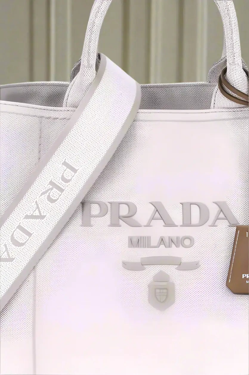 White Prada handbag with visible branding on a white background