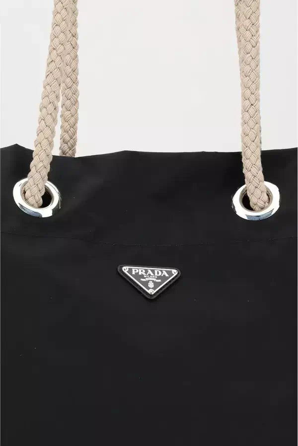 Black Prada bag with rope handles on a white background