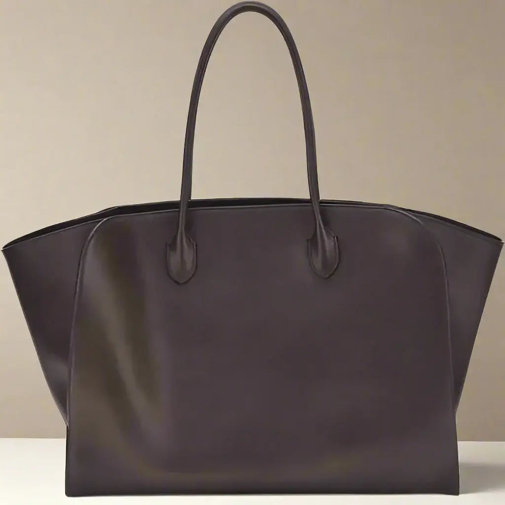 Brown leather tote bag on a white background
