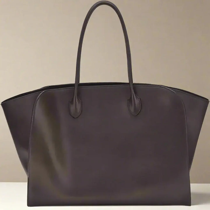 Brown leather tote bag on a white background