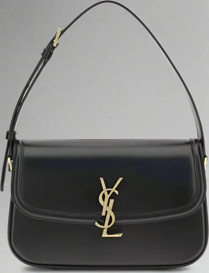 Black handbag with gold logo on a white background