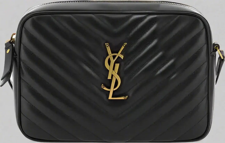 Black quilted handbag with gold logo on a white background