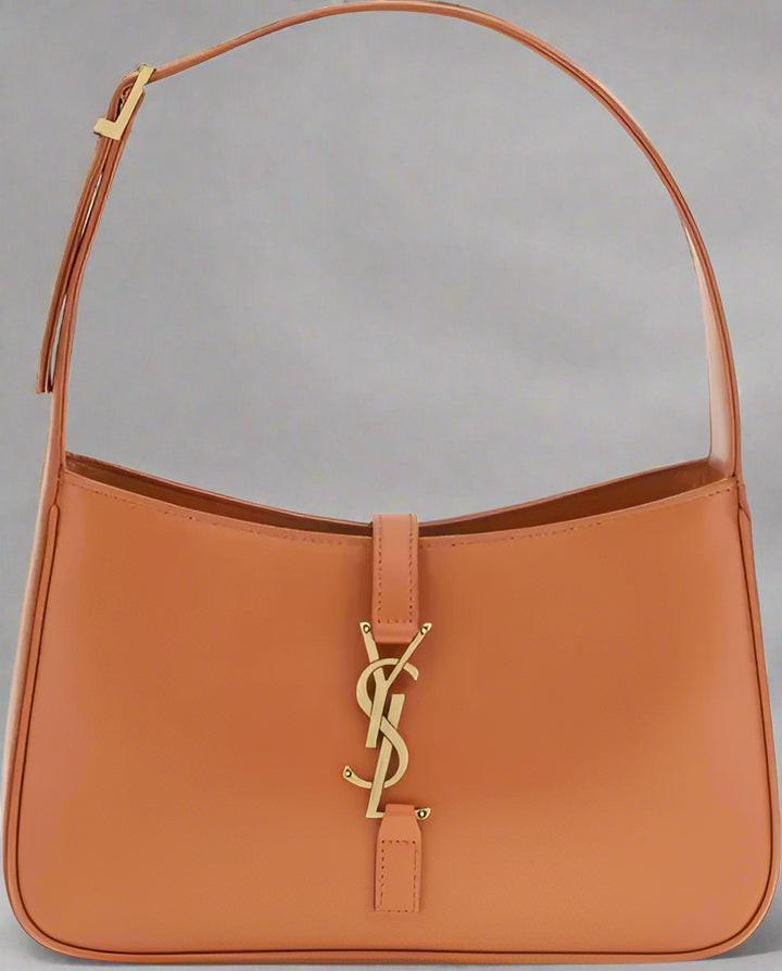 Brown handbag with a gold logo on a white background