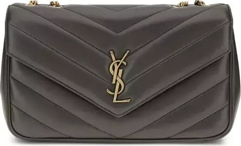 Gray quilted handbag with a gold logo on a gray background
