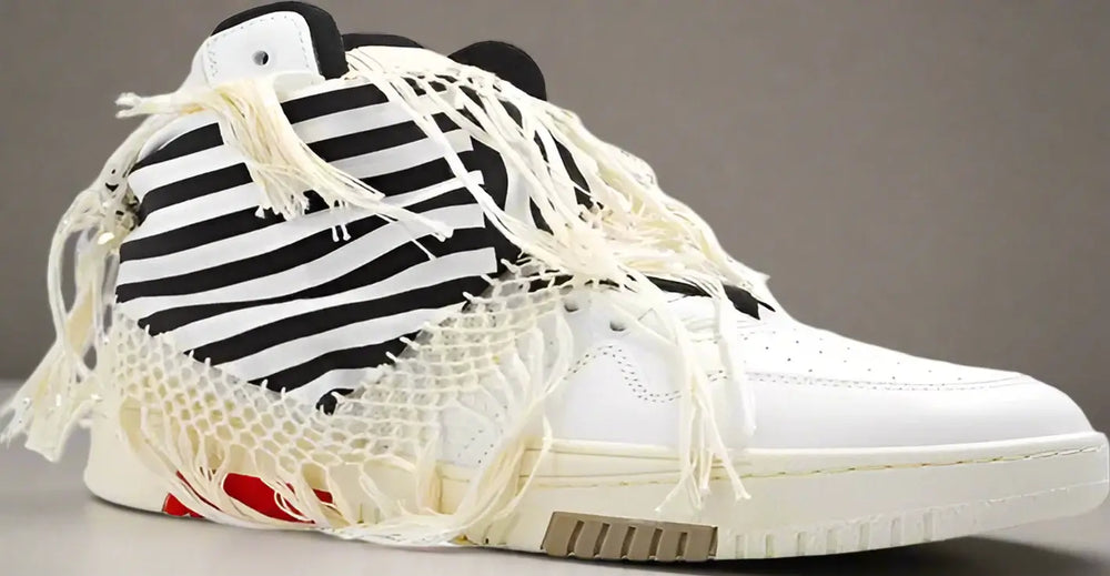 White high-top sneakers with black and red accents on a white background