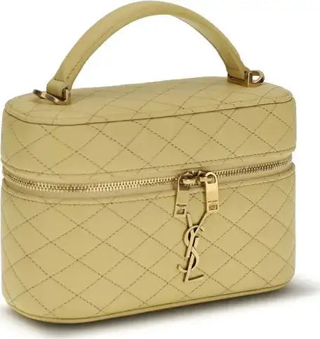 Beige quilted handbag with gold accents on a white background