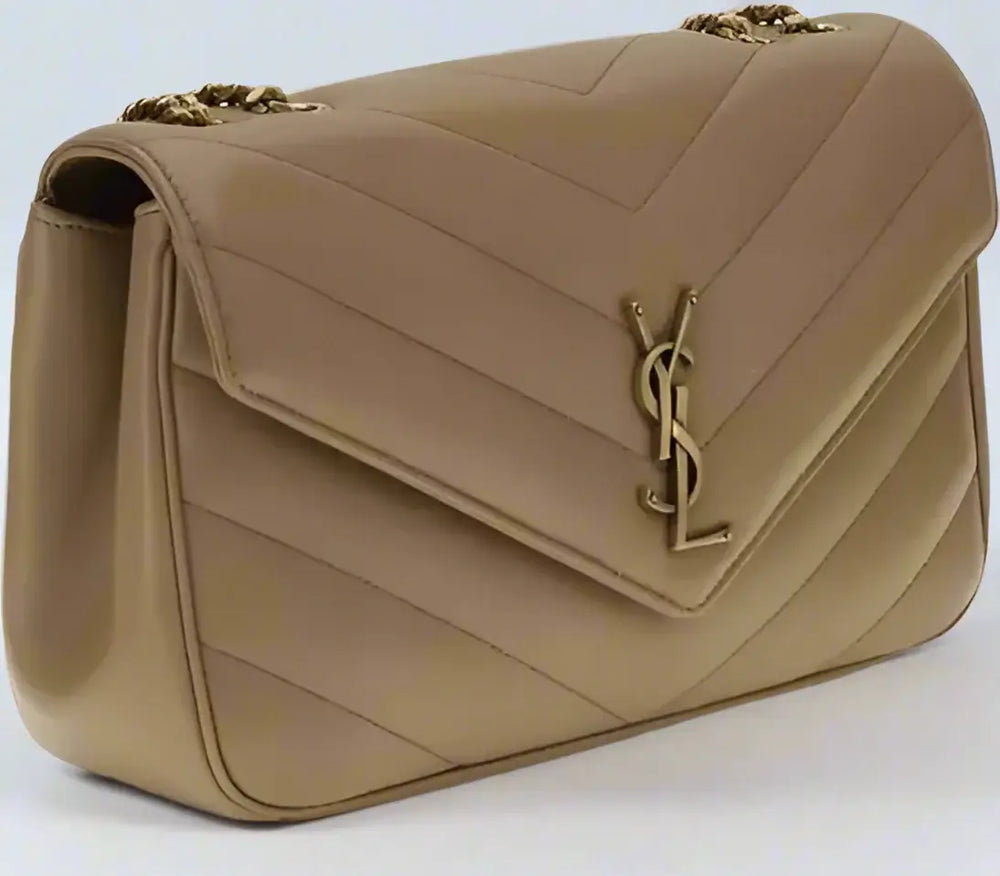 Beige handbag with a gold logo on a white background