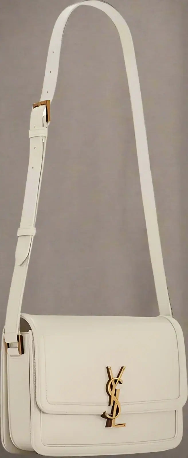 Beige handbag with a gold logo on a white background