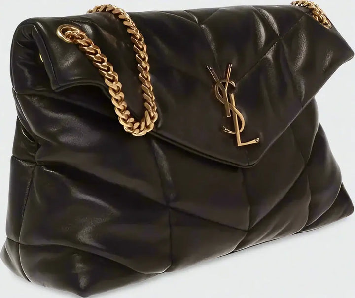 Black quilted handbag with gold chain and YSL logo on a white background