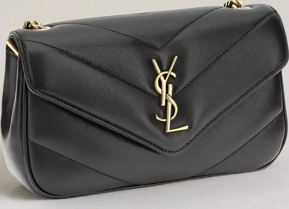 Black handbag with a gold logo on a white background