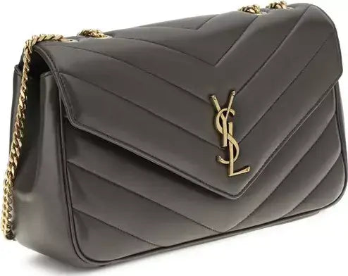 Gray handbag with gold chain and YSL logo on a white background