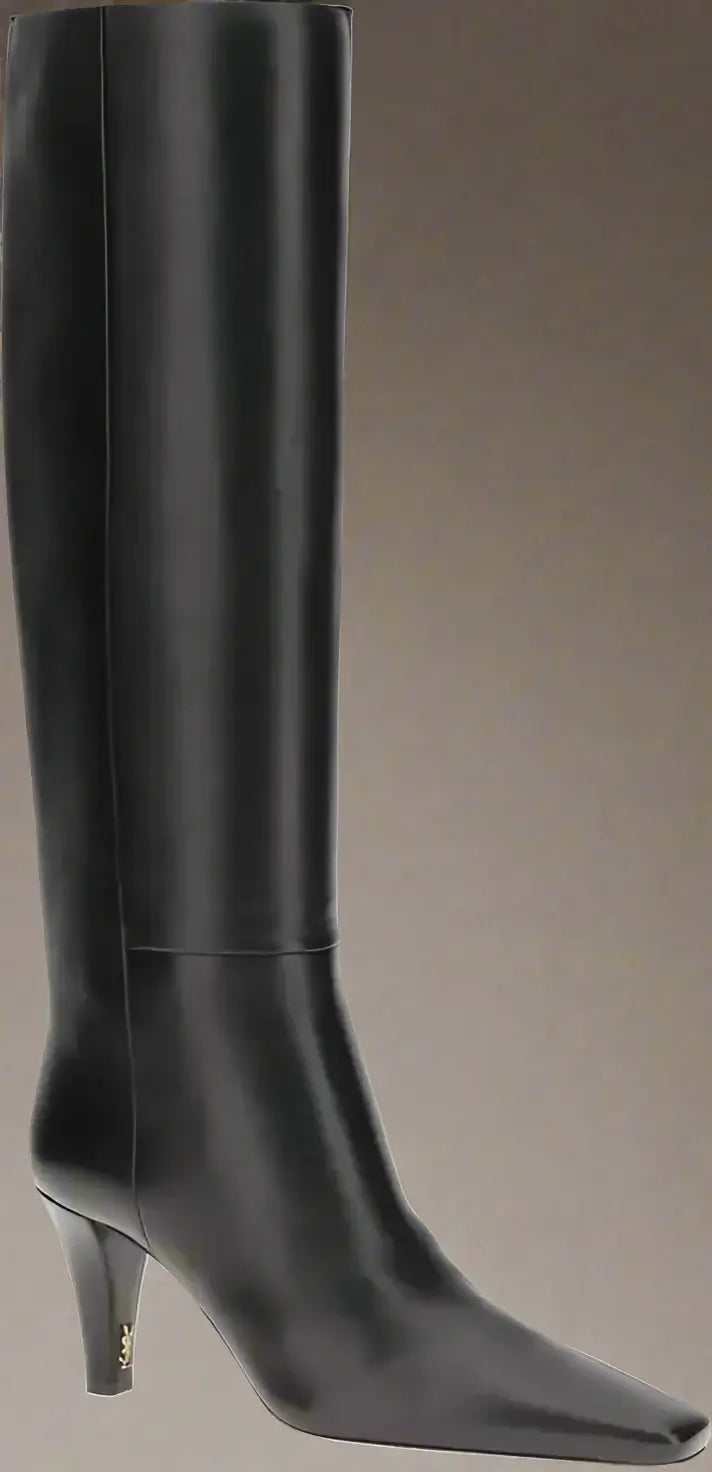 Black knee-high boot on a white background
