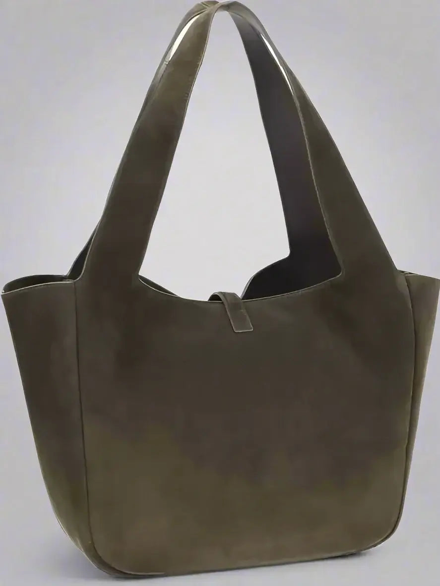 Brown leather handbag on a white background