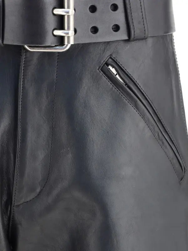 Black leather belt with a silver buckle on a black leather jacket.
