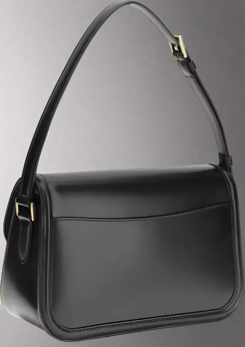Black handbag with a strap on a white background