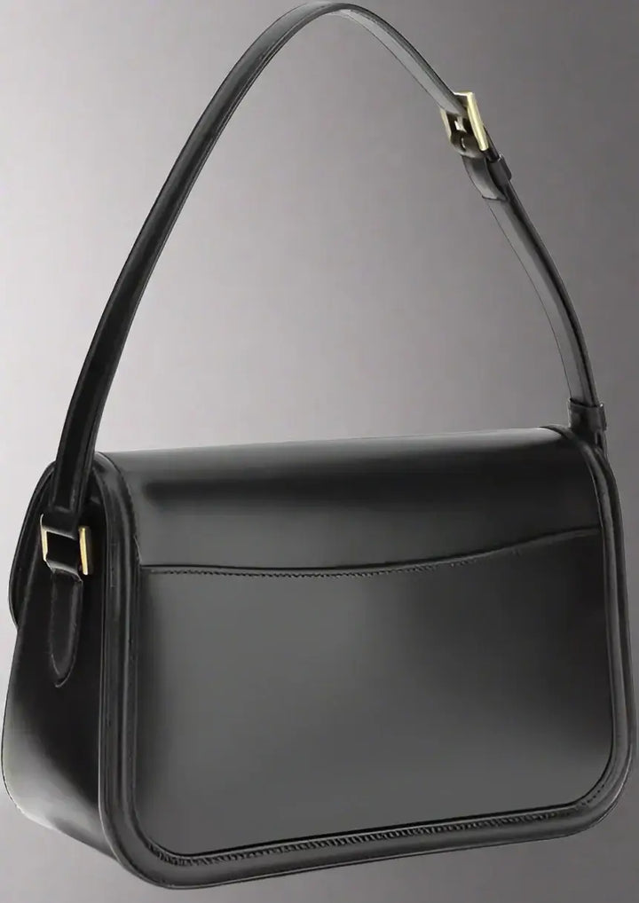 Black handbag with a strap on a white background