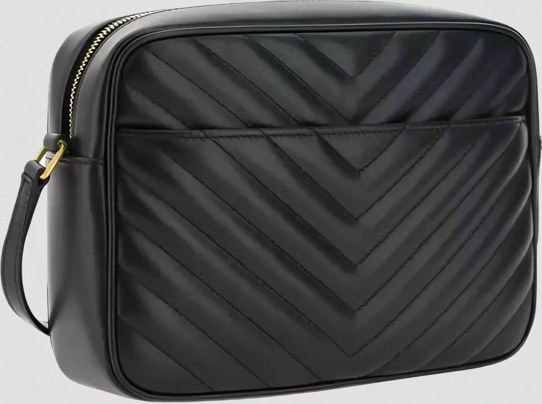 Black chevron-patterned crossbody bag with a gold zipper.