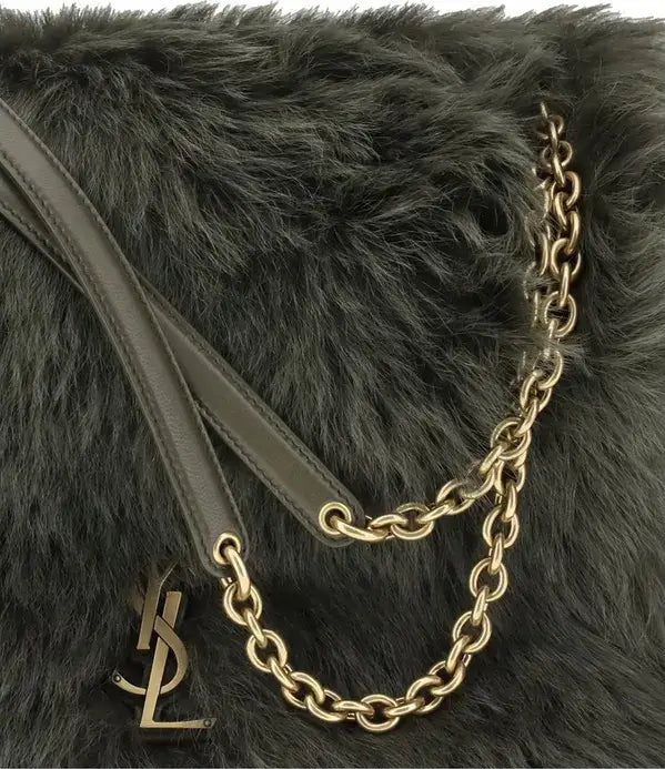 Black fur handbag with a gold chain and logo on a white background