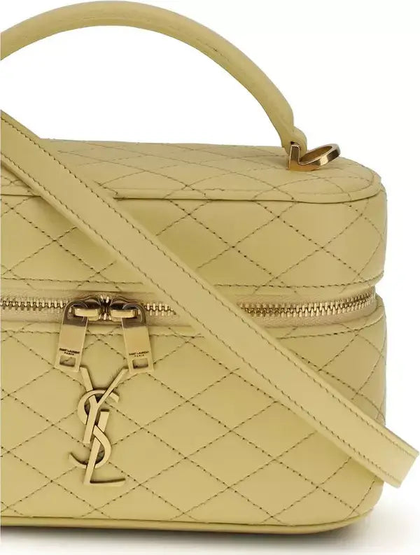 Beige quilted handbag with gold accents on a white background