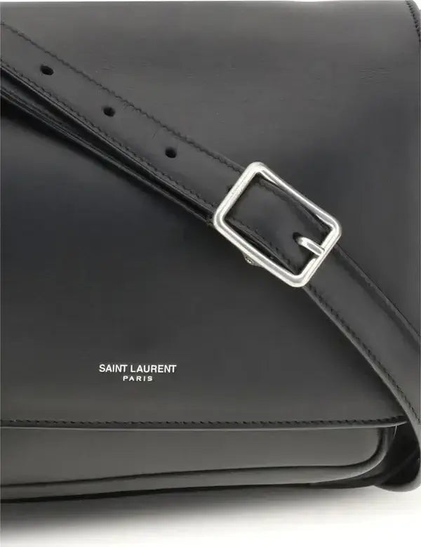 Black leather bag with a silver buckle and 'Saint Laurent Paris' logo.