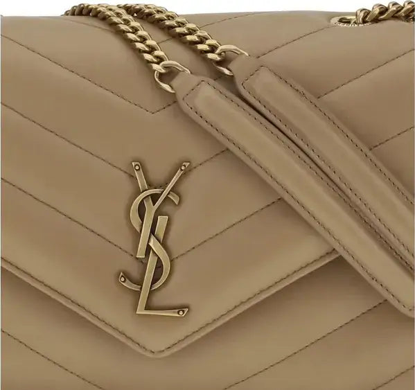 Beige handbag with gold chain and logo on a beige background