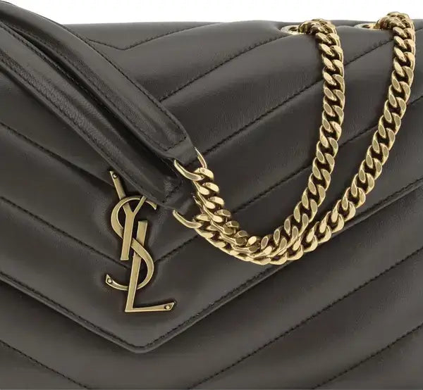 Black quilted handbag with gold chain and YSL logo