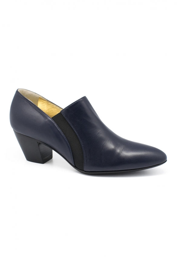 Navy blue shoe with a black heel on a white background