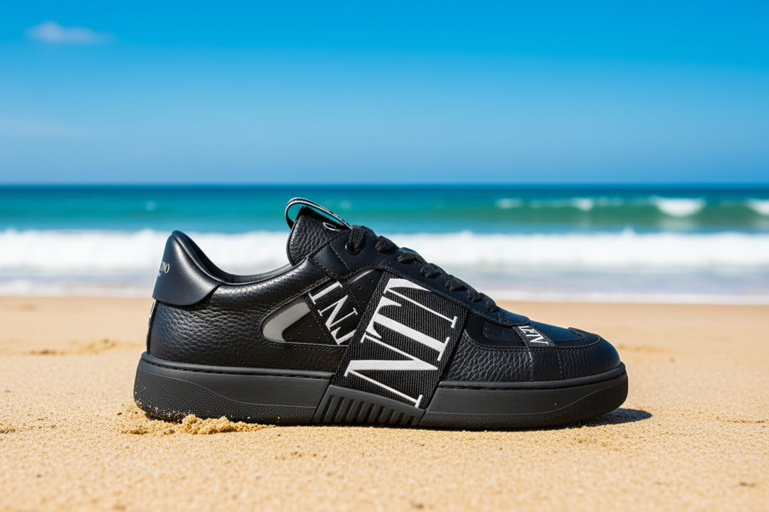 Black sneaker with white text on a white background