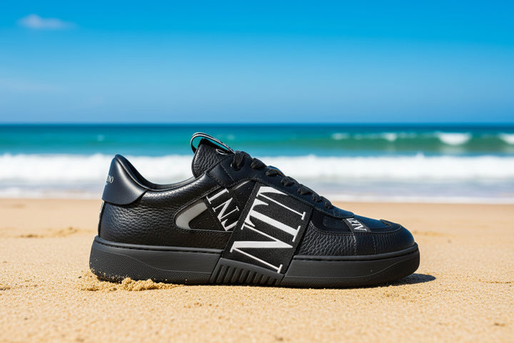 Black sneaker with white text on a white background