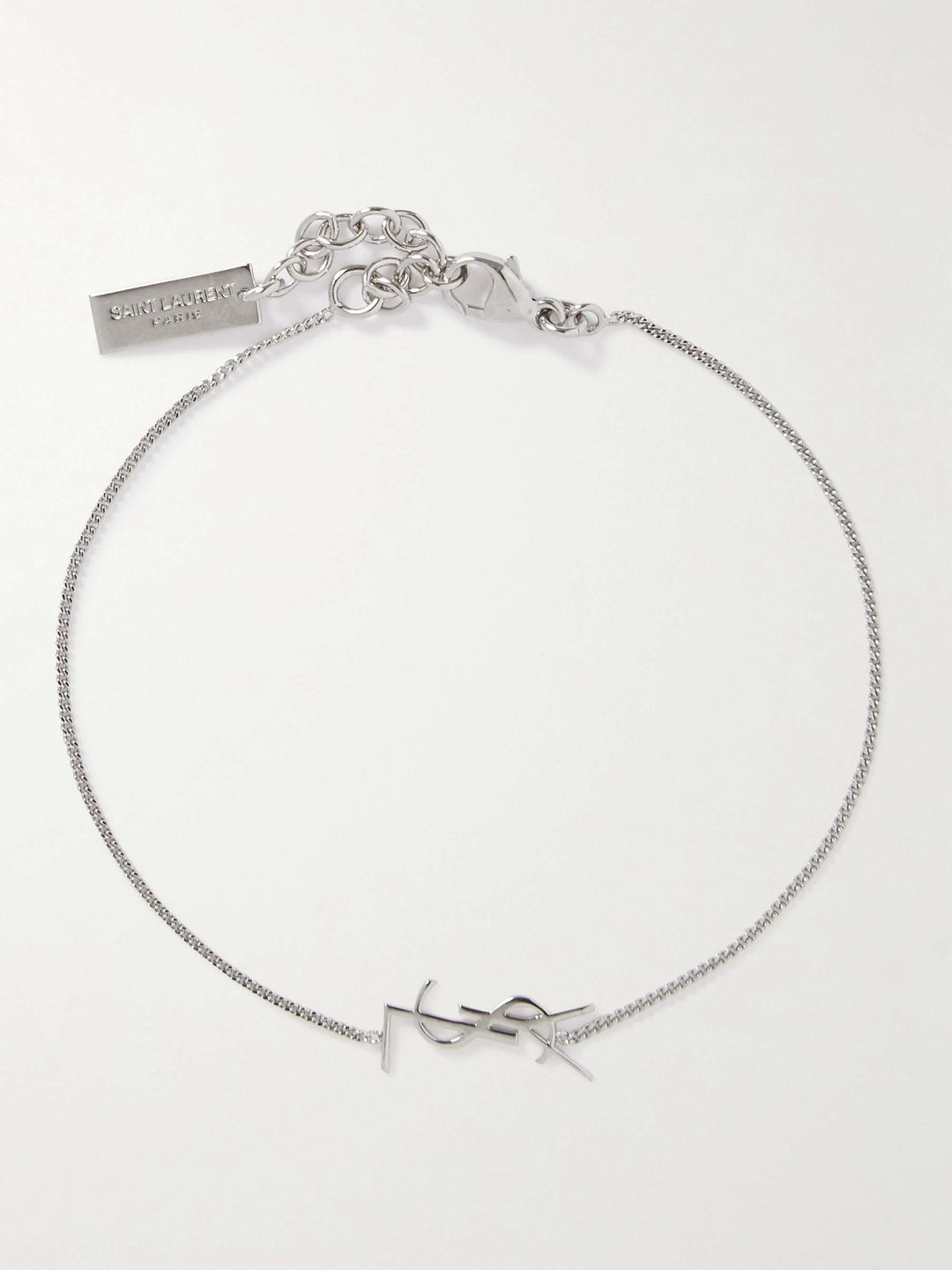 Silver bracelet with a bow design on a white background