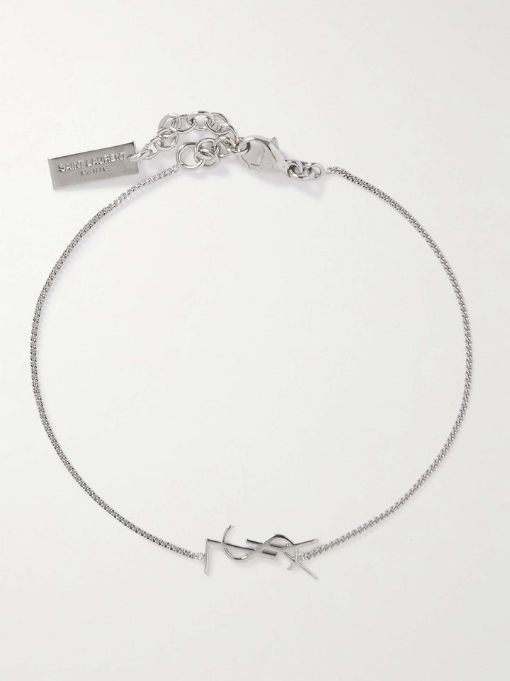 Silver bracelet with a bow design on a white background