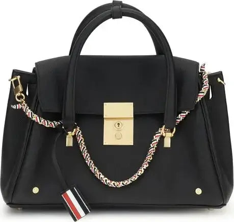 Black handbag with gold accents and a decorative chain strap on a white background