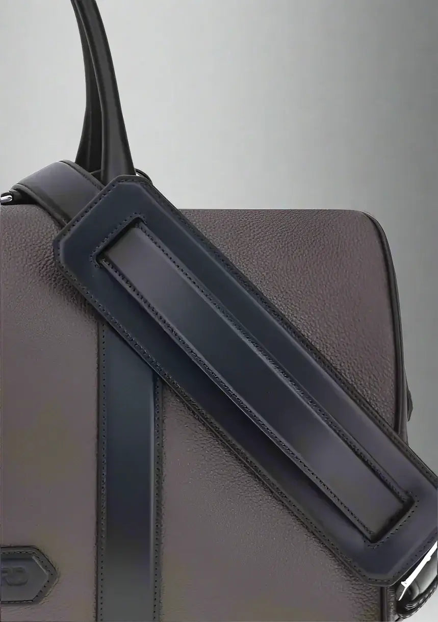 Gray backpack with a black strap on a white background