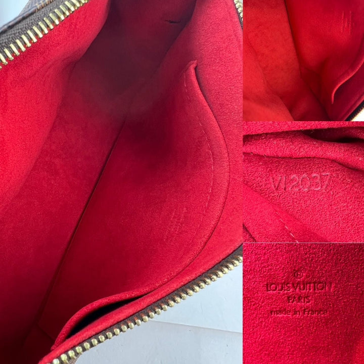 Close-up of a red Louis Vuitton bag interior with visible branding.