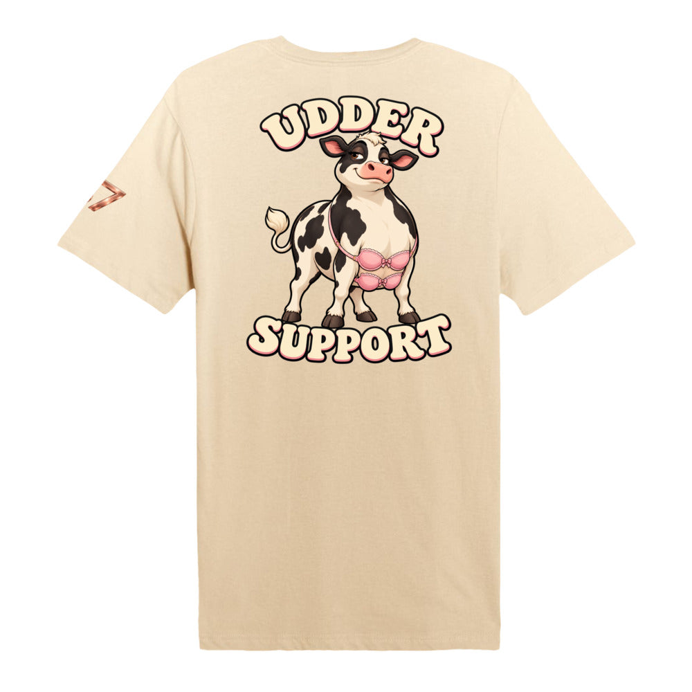 S7 Udder Support T-shirt featuring a smiling cartoon cow wearing two pink bras beneath bold cream-and-pink Udder Support lettering.