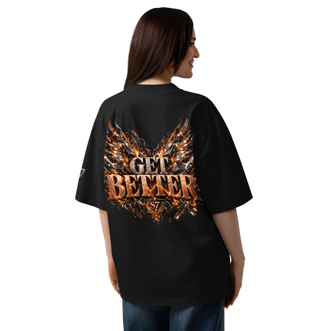 Back view of a woman wearing the DON’T GET EVEN—GET BETTER Transformation T-Shirt | S7 with striking graphics.
