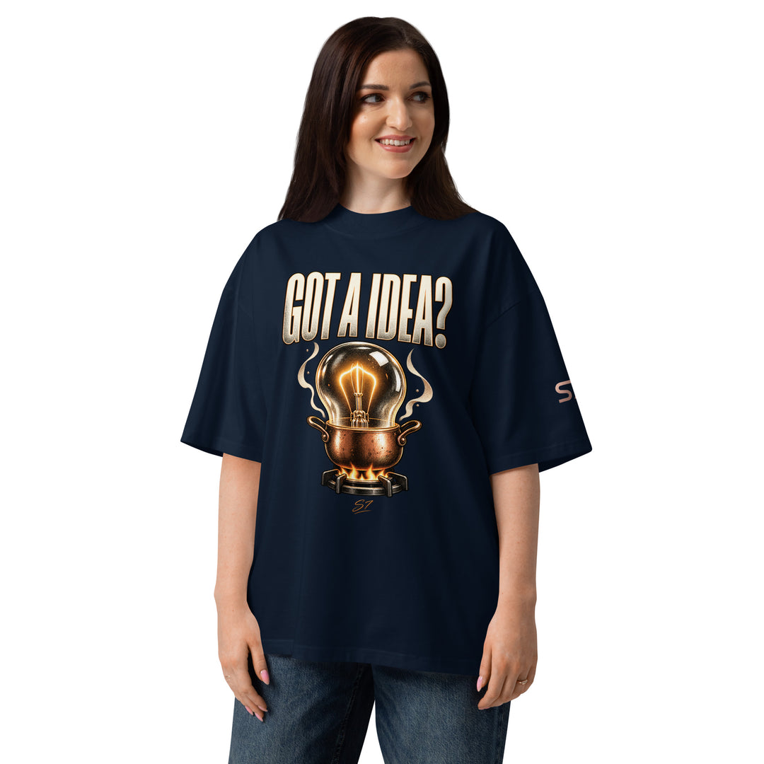 Model wearing S7 “Got A Idea? Let It Cook” Graphic T-Shirt with light bulb design on a navy background.