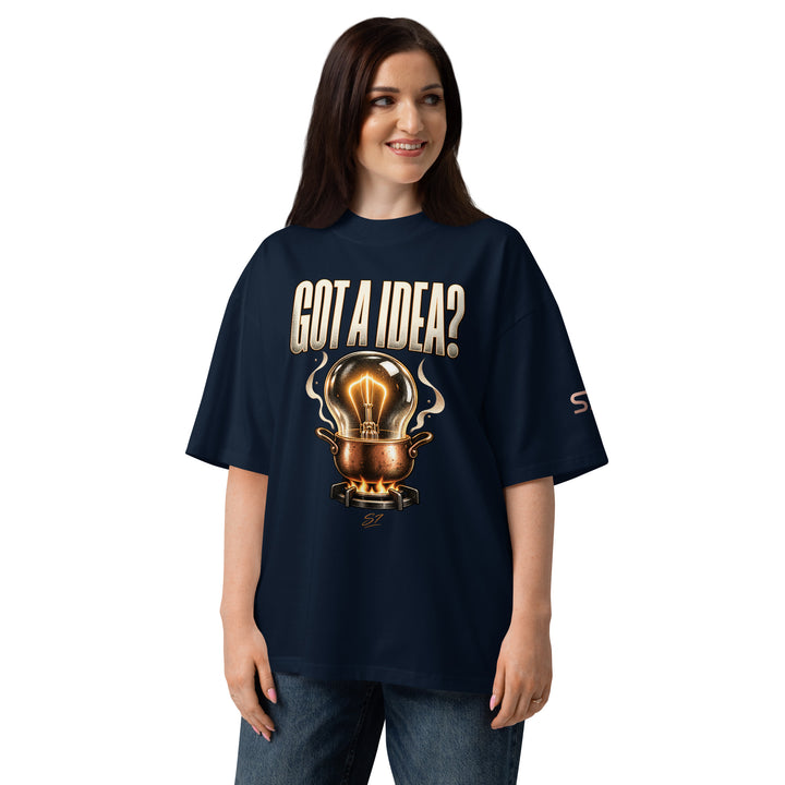 Model wearing S7 “Got A Idea? Let It Cook” Graphic T-Shirt with light bulb design on a navy background.